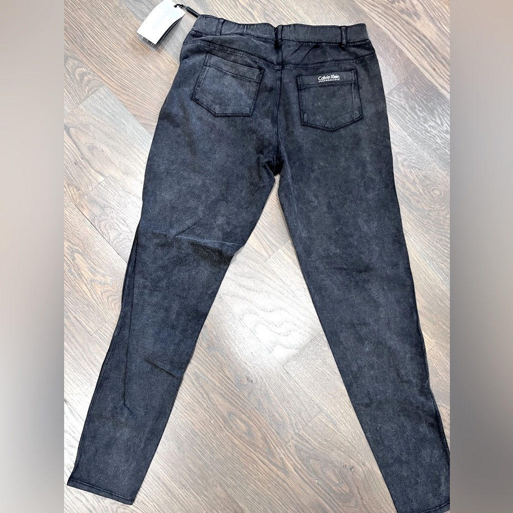 NWT- Calvin Klein stretch pants. Size M. Black distressed look